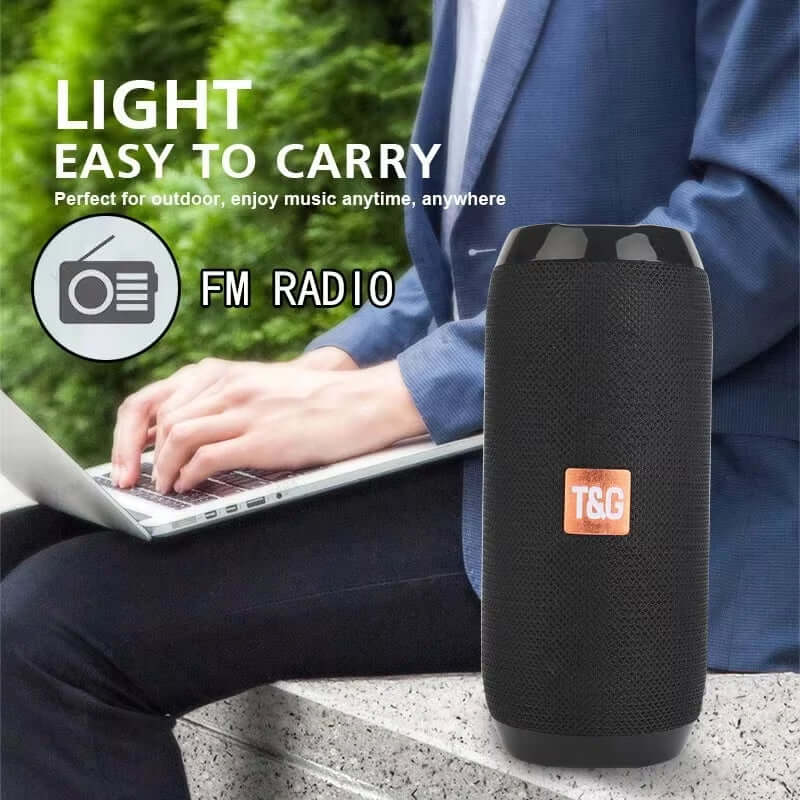 Lightweight portable Bluetooth speaker with FM radio, ideal for outdoor use and easy to carry.